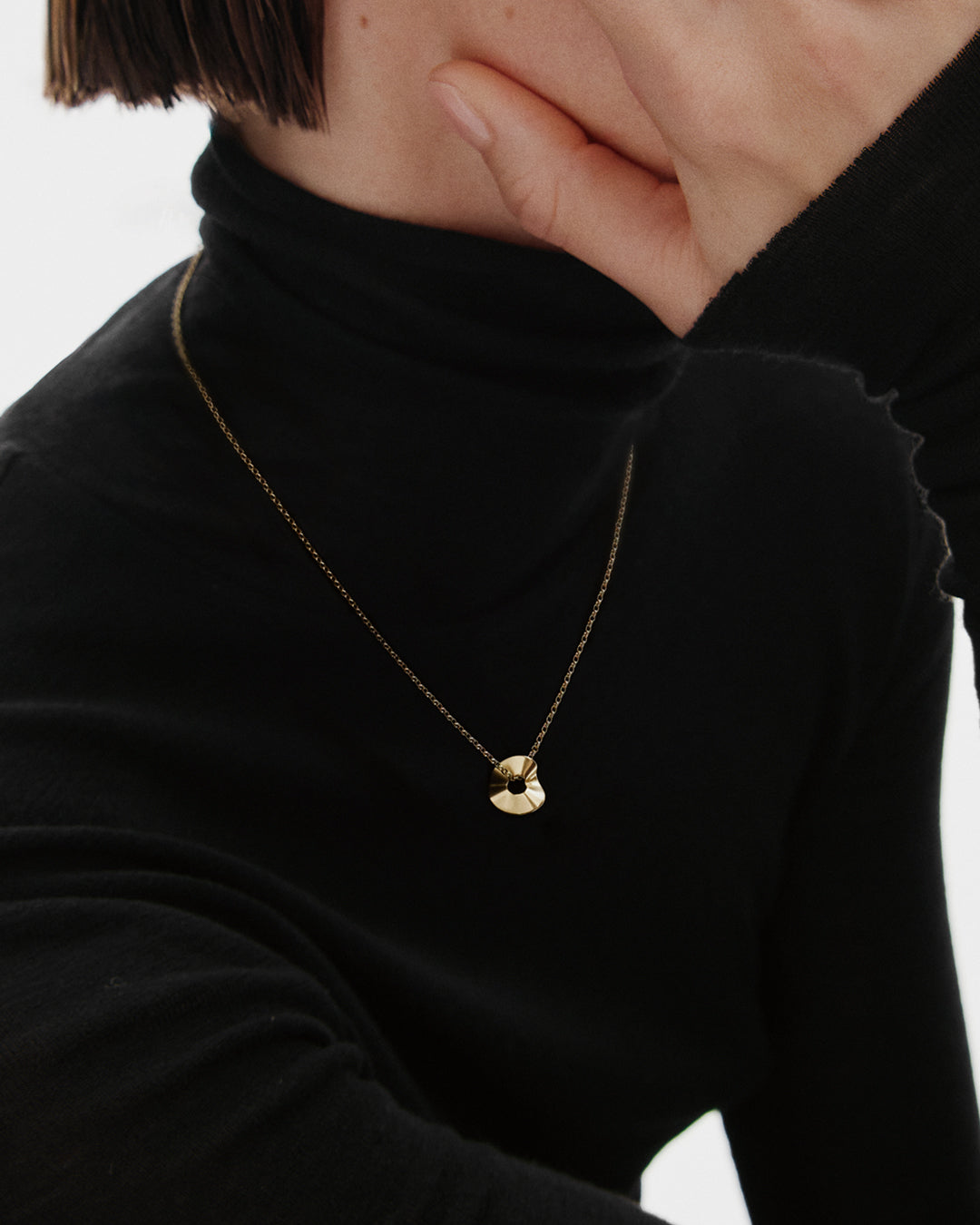 Vetovoima-riipus pronssi