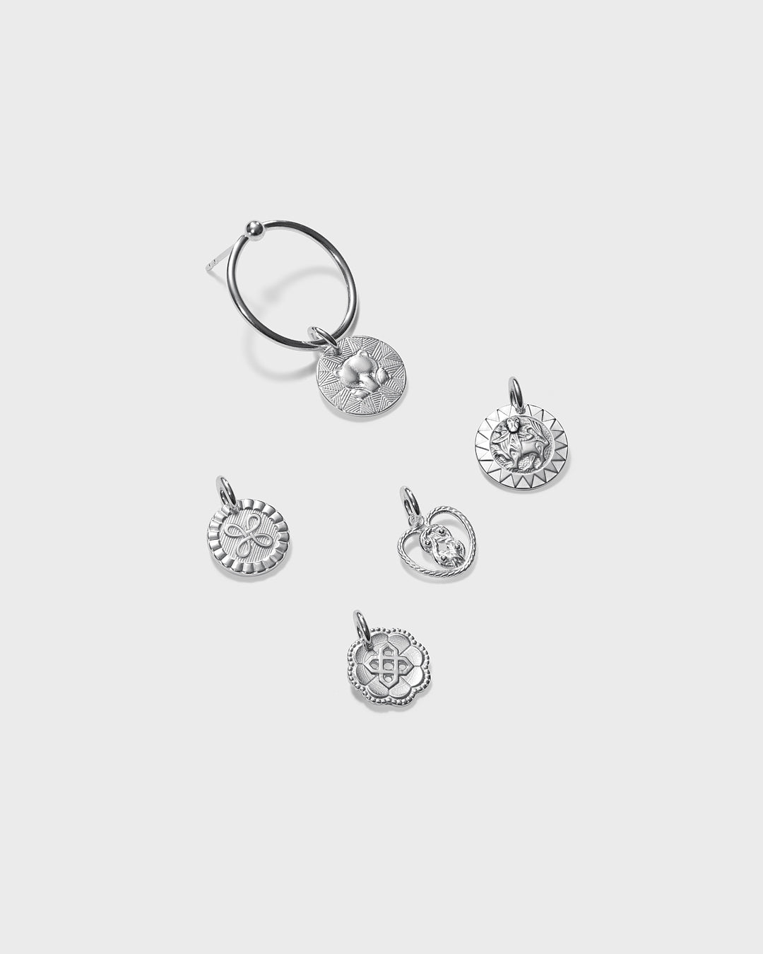 Amulet earrings silver half pair left