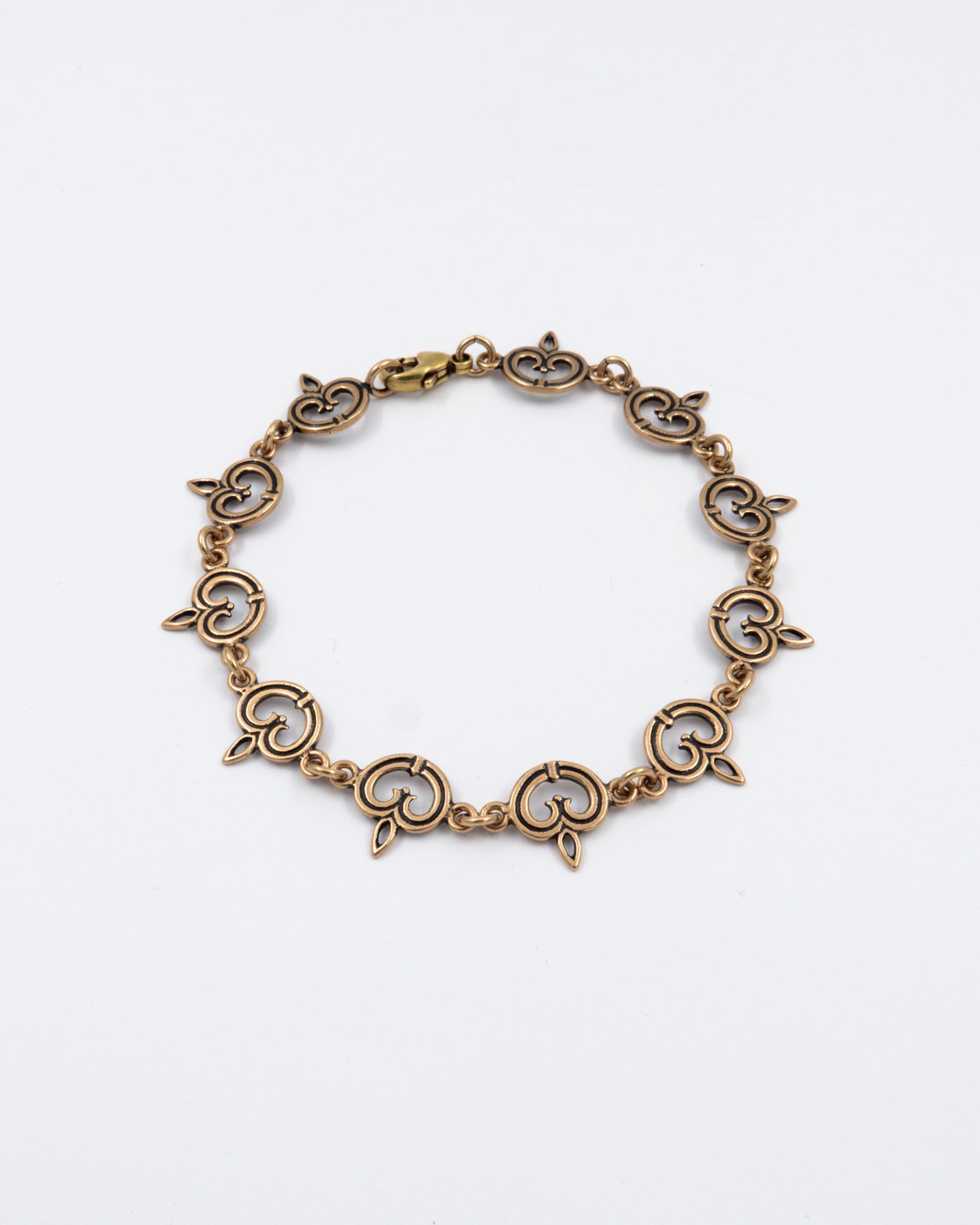 Pidetty Karjalainen nauhapunos -rannekoru pronssi