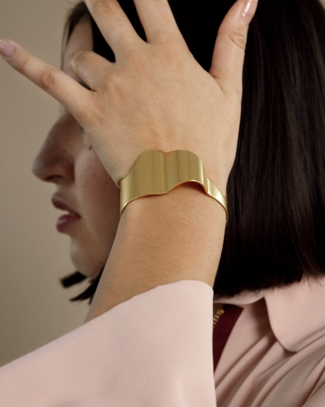 Vetovoima-rannekoru kapea pronssi