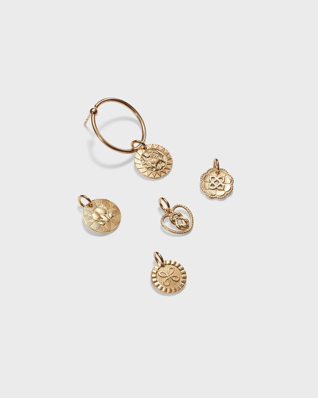 Amulet earrings bronze half pair left