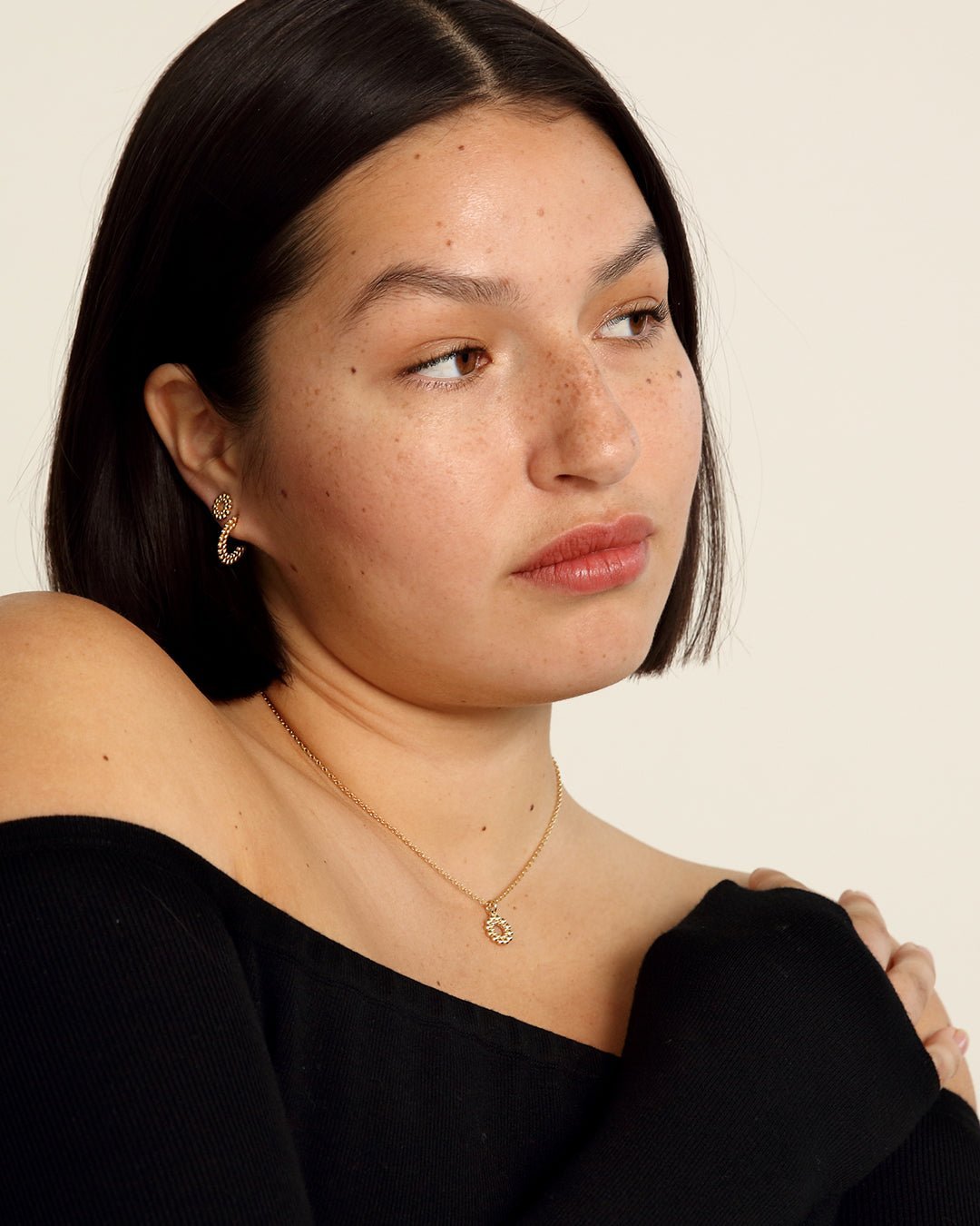 Valoisa-nappikorvakorut pronssi puolipari oikea