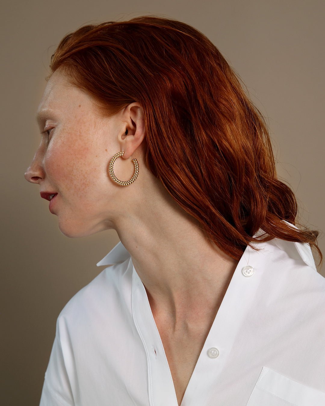 Circle of Light big hoop Earrings bronze half pair right