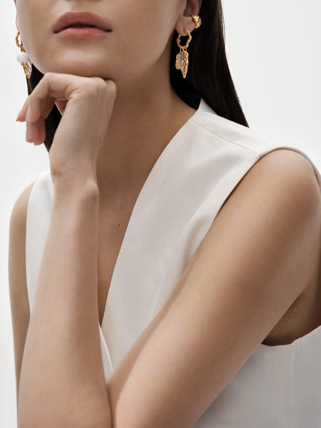 Itu-korvakorut rengas hopea kullattu