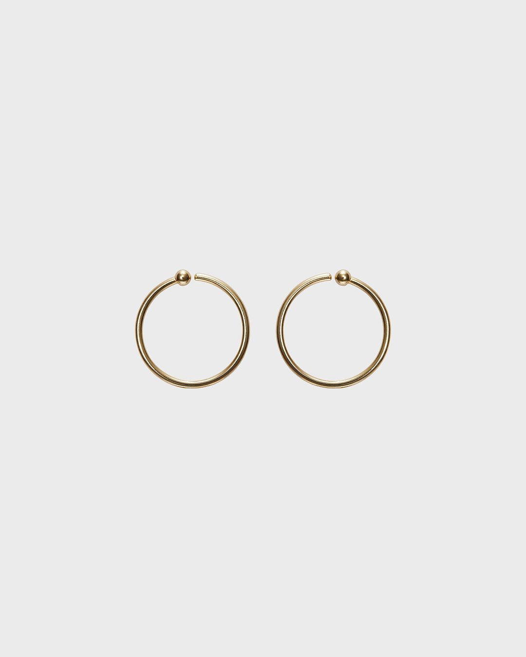 Amulet earrings bronze half pair left